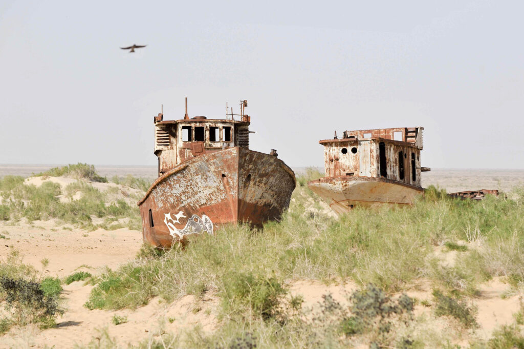 Fishing boats left to rust as the Aral Sea shrinks in Central Asia. Photo: IWMI