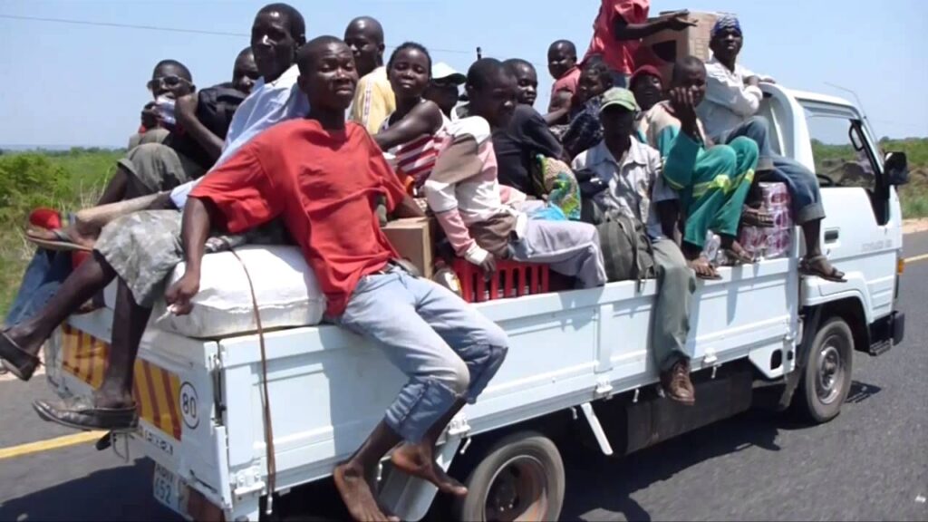 A group of youth riding in the back of a truck en route from a rural community. Photo: Matej Rancigaj