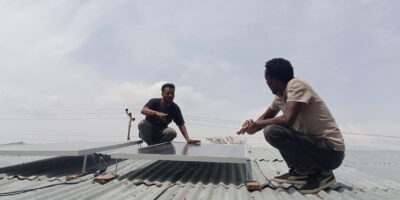 A solar pump technician explaining its maintenance to a farmer in Oromia Region, Ethiopia. Photo: Yonas Tafesse / IWMI